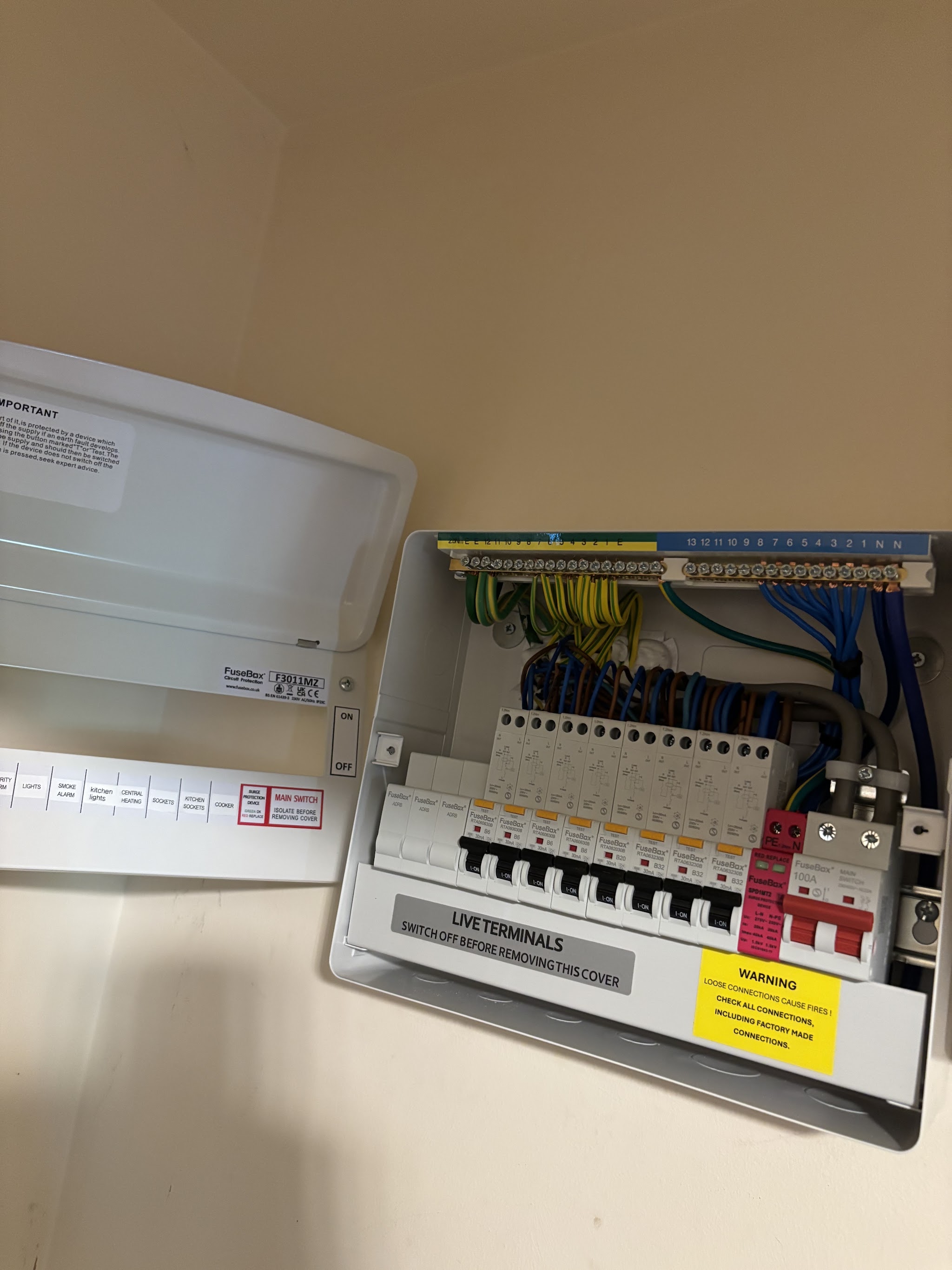 New consumer unit with neatly dressed wiring and labelled circuits
