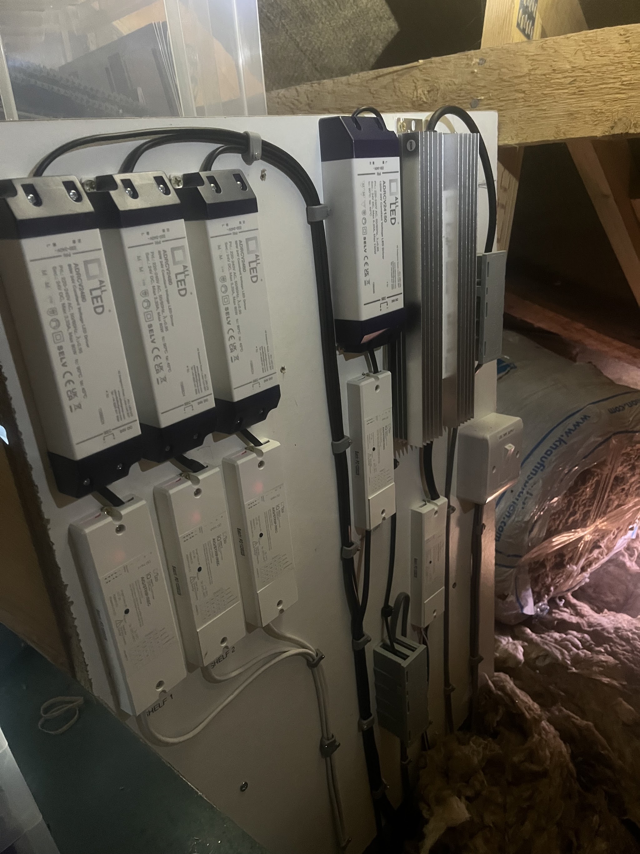 LED lighting drivers mounted neatly on a board in a loft